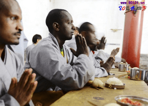African Monks Pray Before Eating