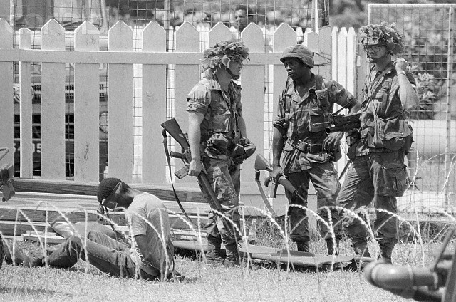 US Soldiers Guarding Prisoner