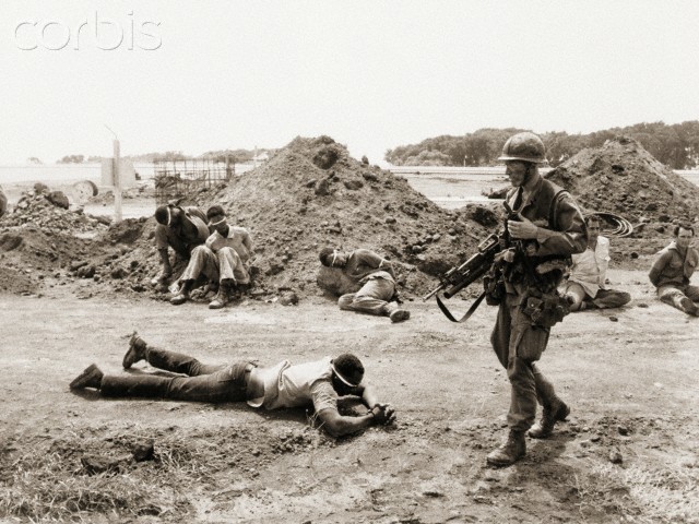 US Soldier Guarding Prisoners