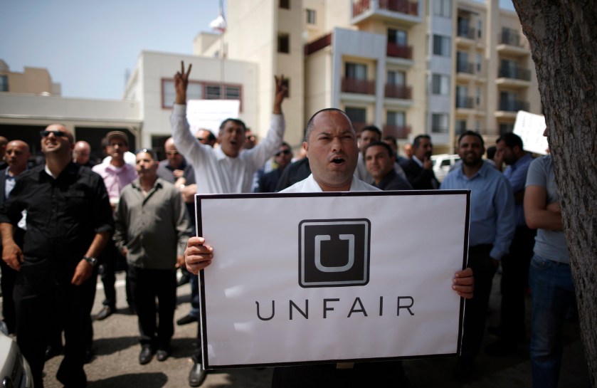 Uber drivers protest against working conditions outside the company's office in Santa Monica