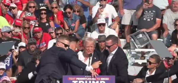 Donald Trump being helped off the stage at a rally in Butler, Pennsylvania