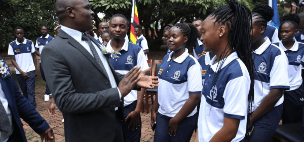 A Zimbabwean official speaks to students during a send-off ceremony at the Harare Polytechnic in Harare, Zimbabwe, on March 6, 2025.
