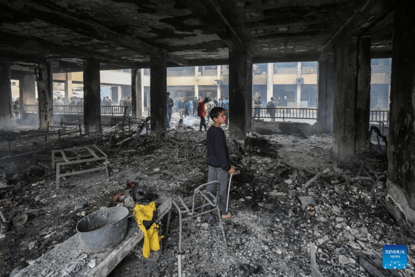 Palestinians are seen at a school after an Israeli airstrike in Gaza City, on April 23, 2025.