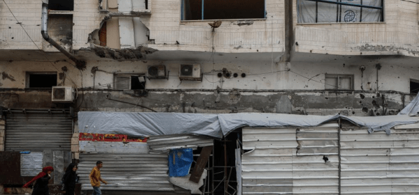 People walk past a closed bakery in Gaza City, on April 1, 2025. The aid blockade has forced the shuttering of 25 bakeries in Gaza as food supplies shrivel, Israel's evacuation orders increase and bombardments continue, UN humanitarians said on Tuesday. (Photo by Rizek Abdeljawad/Xinhua)