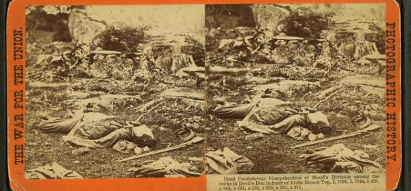 Dead Confederate sharpshooters of Hood's Division among the rocks in Devil's Den in front of Little Round Top.