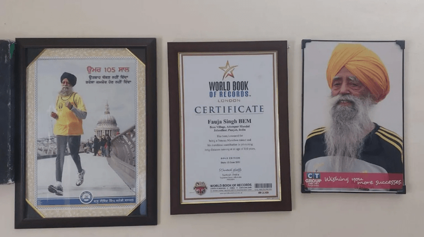 Mementoes and certificates on the wall at Singh's house in Punjab