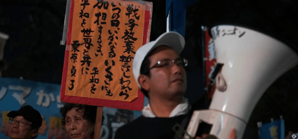 This photo taken on Aug. 5 shows protesters gathering at Hiroshima Atomic Bomb Dome, Hiroshima, Japan to criticize the Japanese government's ongoing military buildup policies. (Xinhua/Jia Haocheng)
