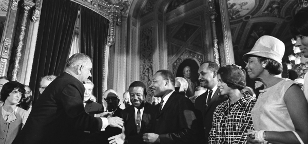 President Lyndon B. Johnson moves to shake hands with Martin Luther King Jr. while others look on after Johnson signed the federal Voting Rights Act into law at the U.S. Capitol in Washington, D.C., on Aug. 6, 1965. Yoichi Okamoto/Lyndon B. Johnson Library
