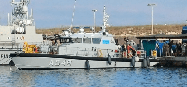 Migrants disembark from a boat that rescued them after two vessels sank off the coast of Italy's Lampedusa island. Photo: Getty Images