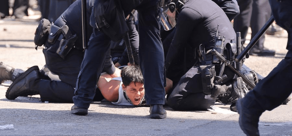 A protester is arrested by Los Angeles Police Department police officers in front of the Los Angeles Federal Detention Center, in Los Angeles, California, the United States, June 8, 2025. (Photo by Qiu Chen/Xinhua)