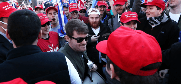 Supporters of the America First ideology and U.S. President Donald Trump cheer on Nick Fuentes, a leader of the America First movement and a white nationalist, as he makes his way through the crowd for a speech during the "Stop the Steal" and "Million MAGA March" protests after the 2020 U.S. presidential election was called for Democratic candidate Joe Biden, in Washington on Nov. 14, 2020. Credit: REUTERS/Leah Millis