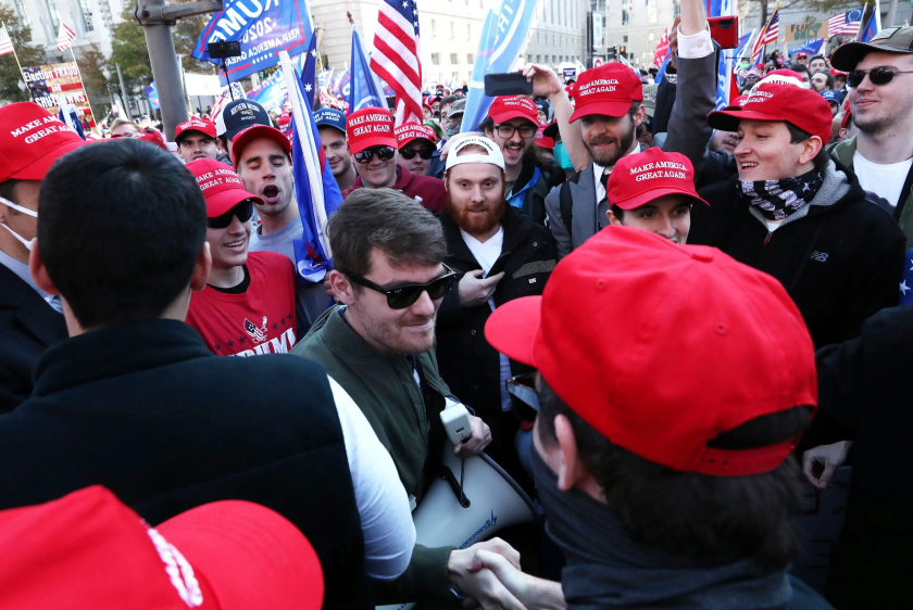 Supporters of the America First ideology and U.S. President Donald Trump cheer on Nick Fuentes, a leader of the America First movement and a white nationalist, as he makes his way through the crowd for a speech during the "Stop the Steal" and "Million MAGA March" protests after the 2020 U.S. presidential election was called for Democratic candidate Joe Biden, in Washington on Nov. 14, 2020. Credit: REUTERS/Leah Millis