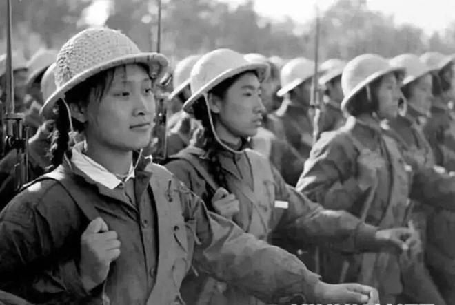 Women's Militia Unit  Wearing Helmets (Wicker Hats) and Overalls at the 10th Anniversary Parade of the National Day in 1959
