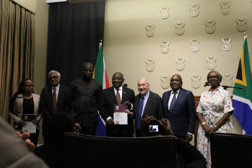 South African President Cyril Ramaphosa (4th R) receives the G20 Extraordinary Committee Report on Global Inequality from Nobel Laureate Joseph Stiglitz (3rd R), UNAIDS Executive Director Winnie Byanyima (1st R), and four other leading global experts of the committee at a ceremony in Cape Town, South Africa, on Nov. 4, 2025. (Photo by Shakirah Thebus/Xinhua)
