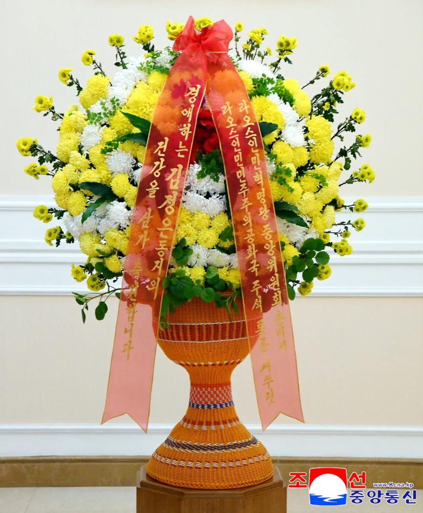 Respected Comrade Kim Jong Un Receives Floral Basket from Lao President