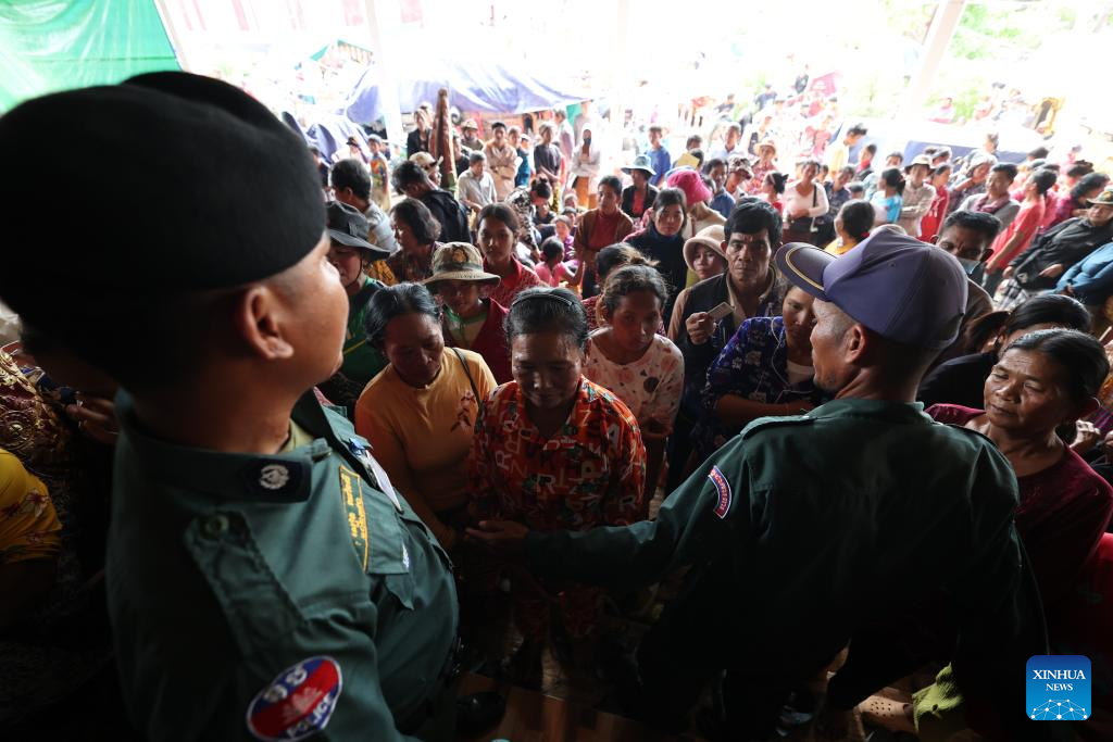 Cambodian evacuees wait for relief items distribution at a safe zone in Siem Reap province, Cambodia, on Dec. 11, 2025. (Photo by Sovannara/Xinhua)