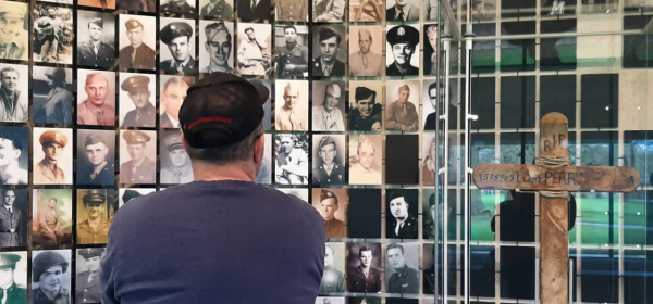 Photos of US soldiers in the visitor centre of the Netherlands American Cemetery in Margraten. Photograph: Rob O'Brien/The Adopted documentary