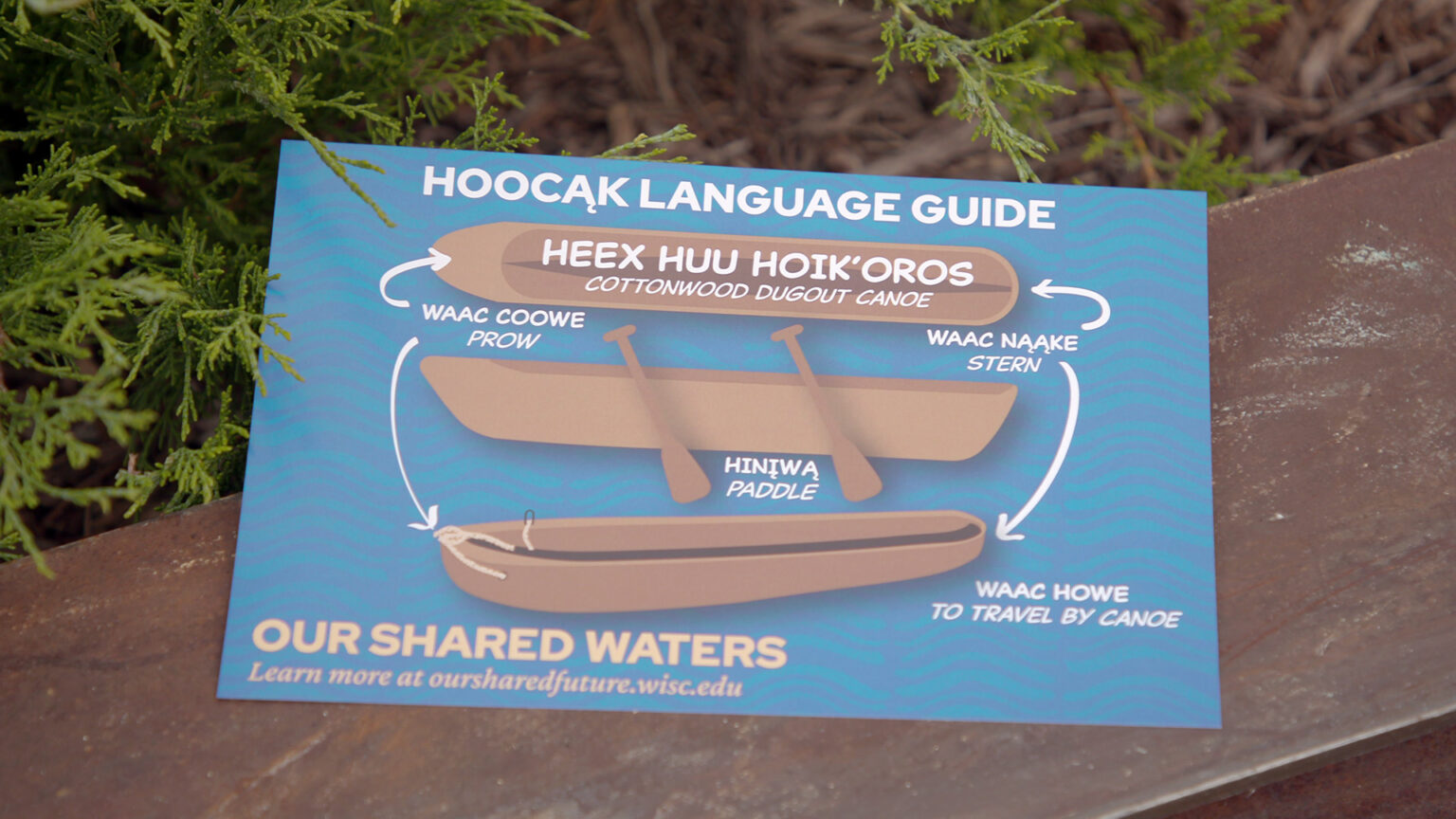 A Hoocąk language guide shows words in the Ho-Chunk language and their American English translations at the "Our Shared Waters" program at Lake Mendota on Sept. 24, 2024, in Madison. (Credit: PBS Wisconsin)