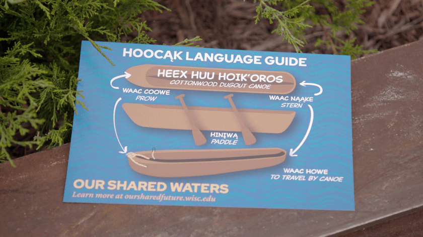 A Hoocąk language guide shows words in the Ho-Chunk language and their American English translations at the "Our Shared Waters" program at Lake Mendota on Sept. 24, 2024, in Madison. (Credit: PBS Wisconsin)