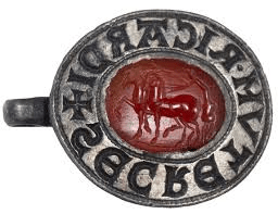 The finely-carved Roman gemstone shows a charioteer standing on a racing chariot, with whip in hand, urging on two high-stepping horses