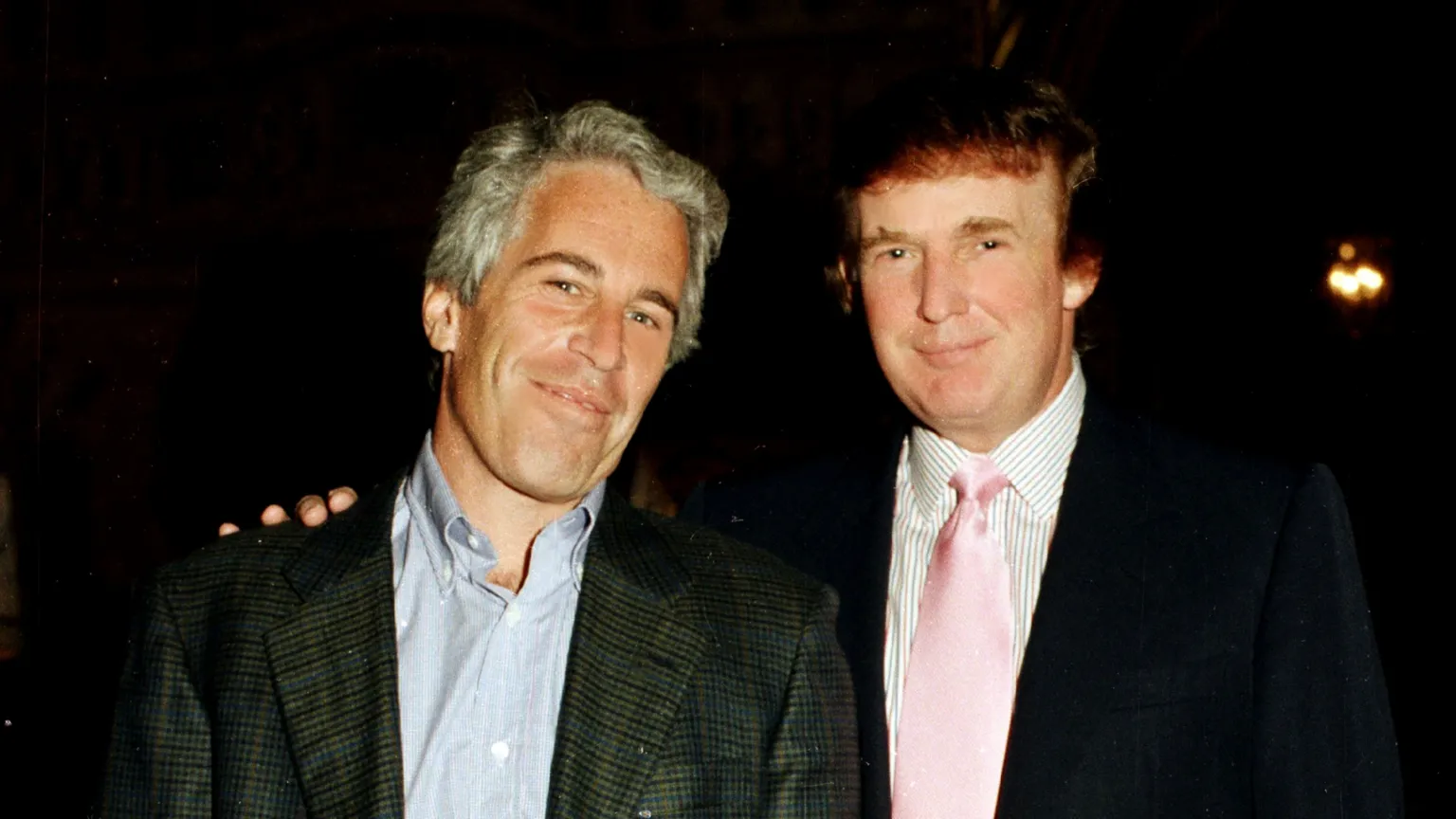 A file photo of Jeffrey Epstein and Donald Trump, then a real estate developer, at Trump's Mar-a-Lago estate in Palm Beach, Florida in 1997