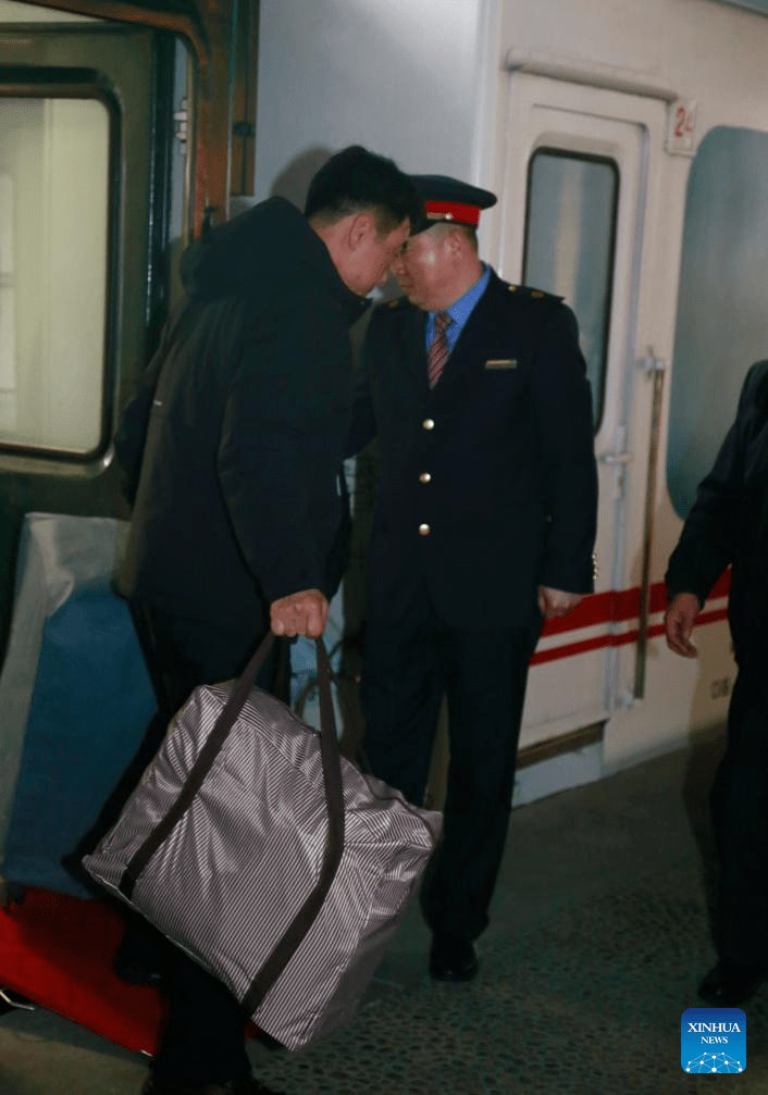 A passenger of an international passenger train from Dandong of China to Pyongyang of the Democratic People's Republic of Korea (DPRK) arrives in Pyongyang, the capital of the DPRK, March 12, 2026.