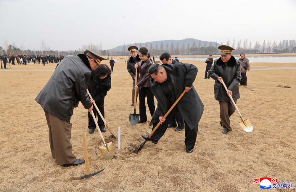 Kim Jong Un, general secretary of the Workers' Party of Korea and president of the State Affairs of the Democratic People's Republic of Korea, planted trees at the pondside park in Saeppyol Street on March 14, the tree-planting day.