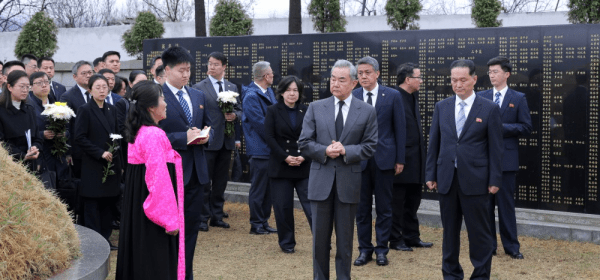 Written on the ribbon of the flower basket were letters "The fallen soldiers of the Chinese People's Volunteers will be immortal".