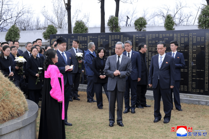 Written on the ribbon of the flower basket were letters "The fallen soldiers of the Chinese People's Volunteers will be immortal".