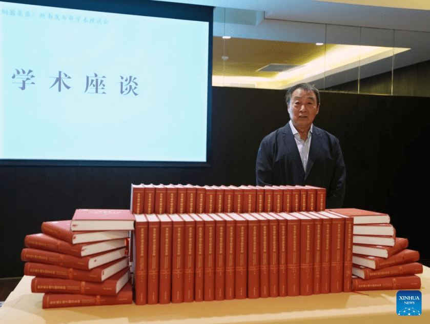 Professor Zhu Fenghan, the lead editor of a sixty-volume compendium documenting more than 23,000 ancient Chinese bronze artifacts lost abroad, poses for a photo during a press conference for the books' release in east China's Shanghai, April 19, 2026. (Xinhua/Liu Ying)