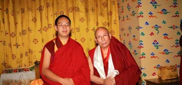 Lungrik Namgyal (R) poses for a photo with the 11th Panchen Lama. (File photo)