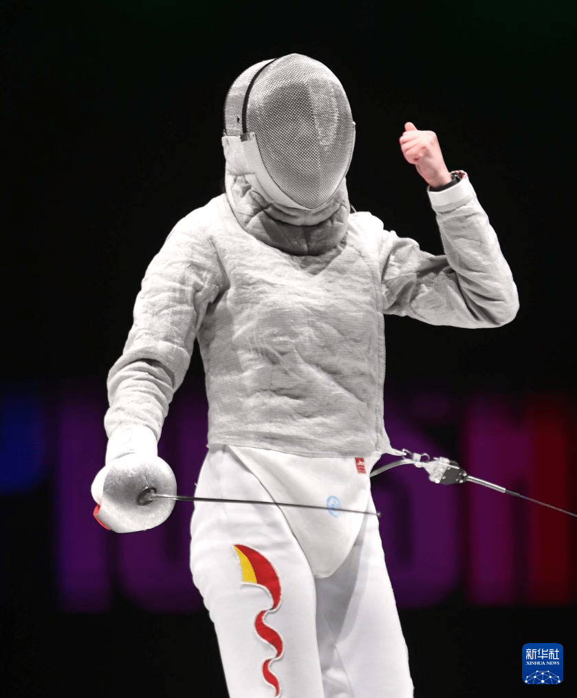 On July 29, Chinese fighter Wei Jiayi celebrates scoring a point during the match.