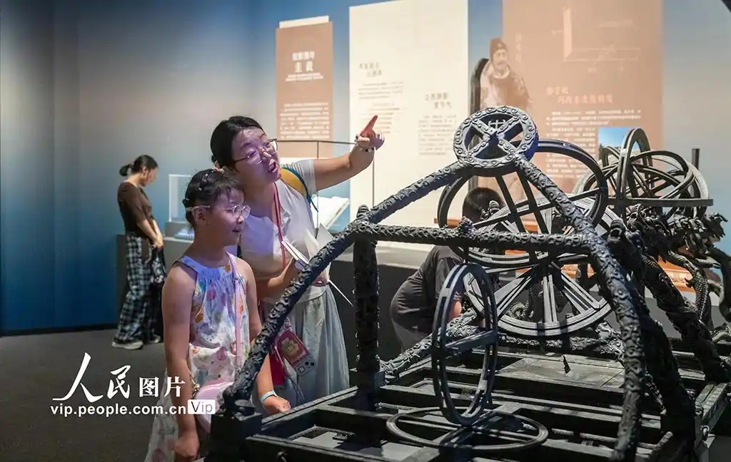 A guide speaks to visitors at an exhibition titled "Heavenly Questions: The Cosmological Vision of Chinese Civilization" at the Anhui Museum in Hefei, east China's Anhui Province, July 1, 2026. (Xinhua/Zhou Mu)