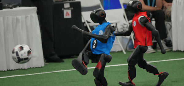Robots play soccer during the World Humanoid Robot Games in Beijing, Sunday, Aug. 23, 2026.