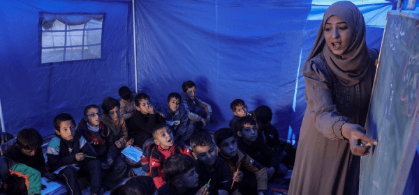 Students attend a class at Al-Shamal Educational School, located just 100 meters from the "Yellow Line" in Jabalia Refugee Camp, northern Gaza Strip, Jan. 12, 2026. (Photo by Rizek Abdeljawad/Xinhua)