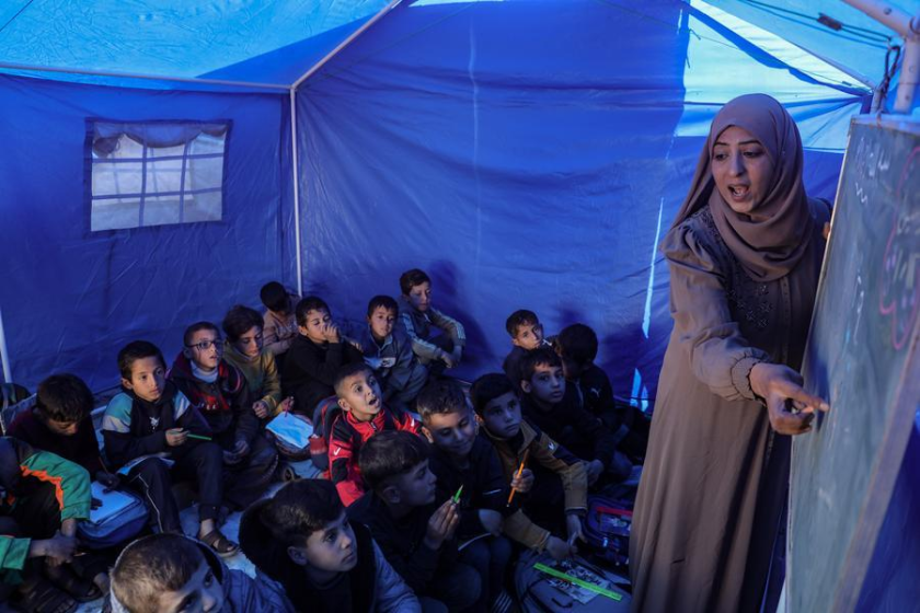 Students attend a class at Al-Shamal Educational School, located just 100 meters from the "Yellow Line" in Jabalia Refugee Camp, northern Gaza Strip, Jan. 12, 2026. (Photo by Rizek Abdeljawad/Xinhua)
