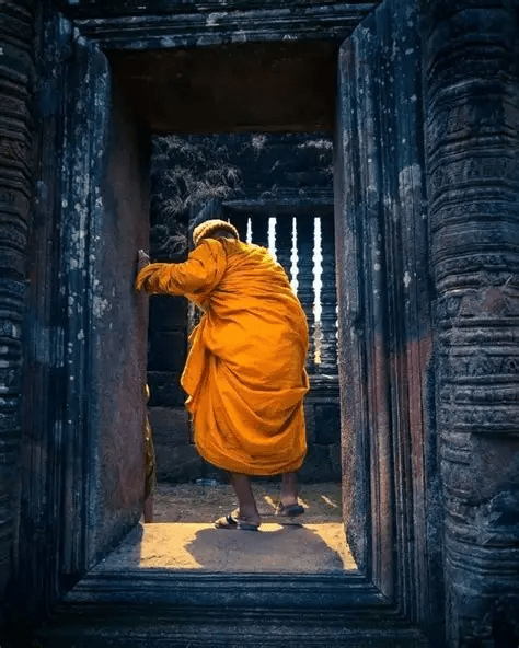 A Theravada Buddhist Monk in the Ruins of “Wat Phu (ວັດພູ)”!