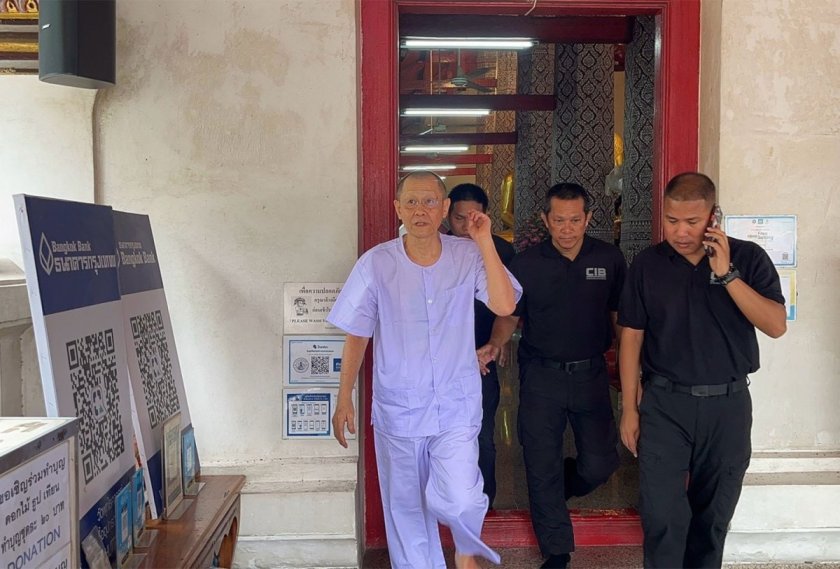 Police escort Atichote Thammavaro, formerly Phra Vajirayan, out of Wat Phutthaisawan in Ayutthaya after he was defrocked on Thursday