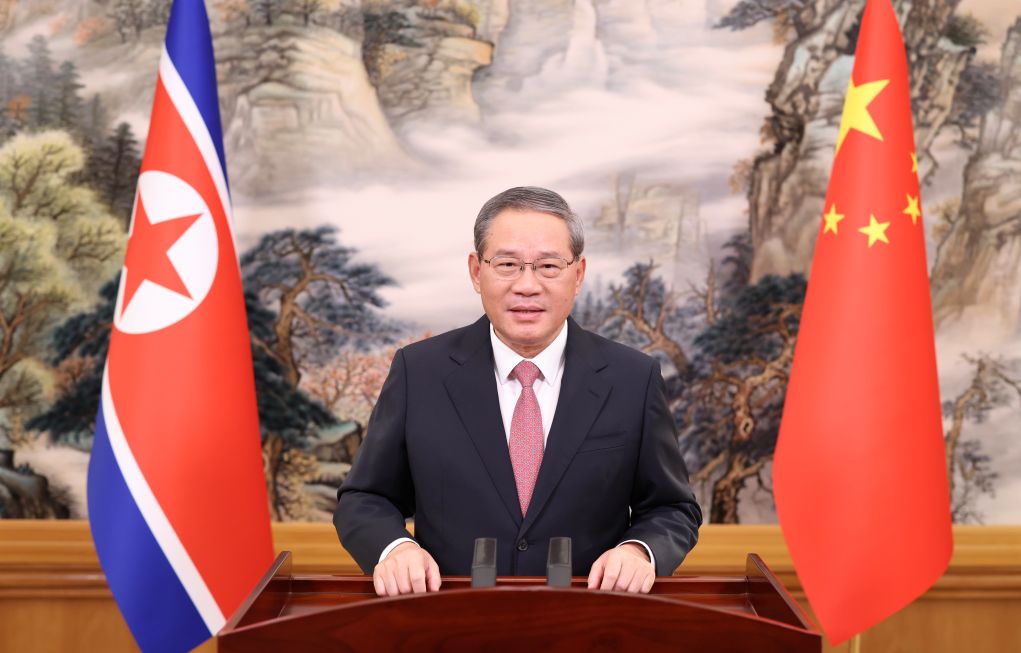 Chinese Premier Li Qiang delivers a video speech at the opening ceremony of the new China-DPRK Yalu River bridge connecting northeast China's Liaoning Province and North Pyongan Province of the Democratic People's Republic of Korea (DPRK), Oct. 15, 2026. (Xinhua/Huang Jingwen)