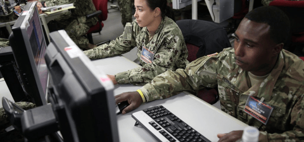 Servicemembers participating in “Cyber Flag,” a weeklong cyber exercise in July 2019. (U.S. Cyber Command Public Affairs). Source: Lawfare Blog