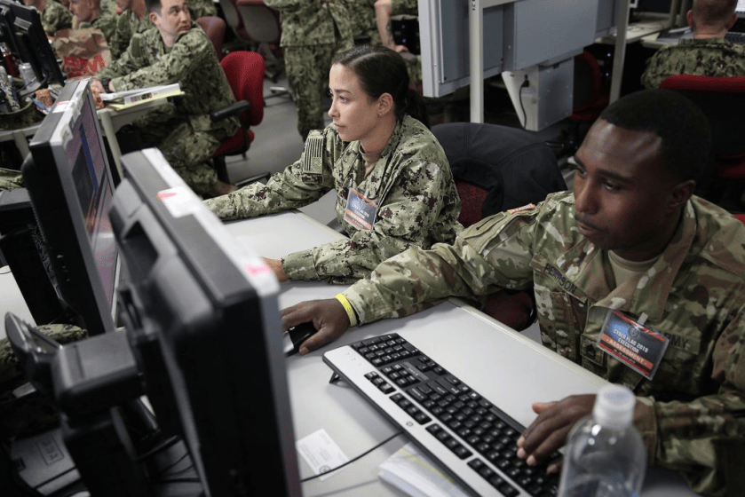 Servicemembers participating in “Cyber Flag,” a weeklong cyber exercise in July 2019. (U.S. Cyber Command Public Affairs). Source: Lawfare Blog