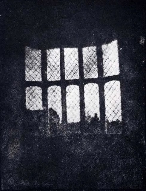 Latticed window at Lacock Abbey, August 1835. A positive from what may be the oldest existing camera negative!